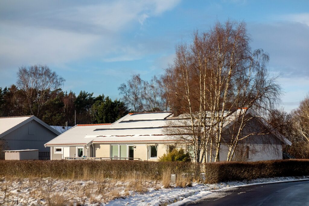 Snow on solar panels on a house in Tuntorp, Brastad, Lysekil Municipality, Sweden.