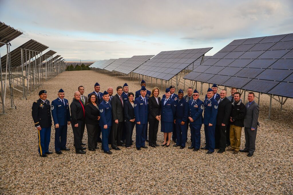 Dr. Elizabeth Sherwood-Randall, Deputy Secretary of Energy, center, poses with Solar Ready Vets participants March 25 at Hill
